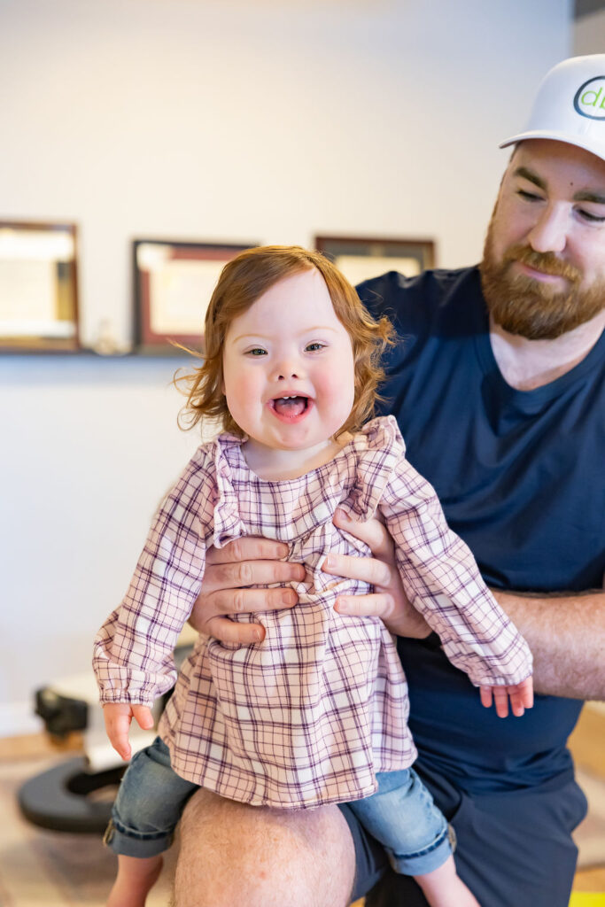 Pediatric Care Moment Smiling Child With Chiropractor